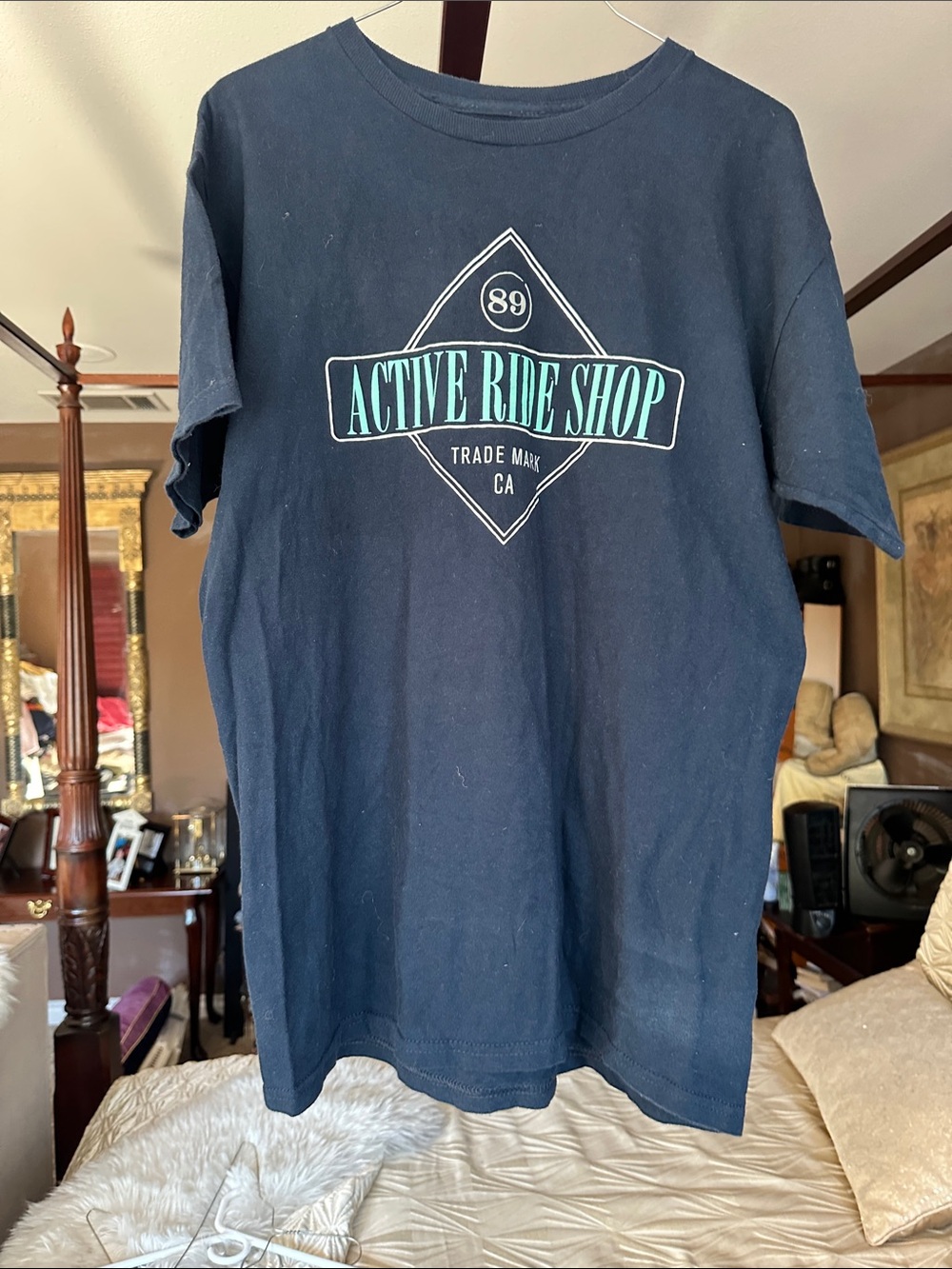 1 for $10 or $3 for $21 Active Ride Shop Navy Tee w/ Teal & White Chest Graphic